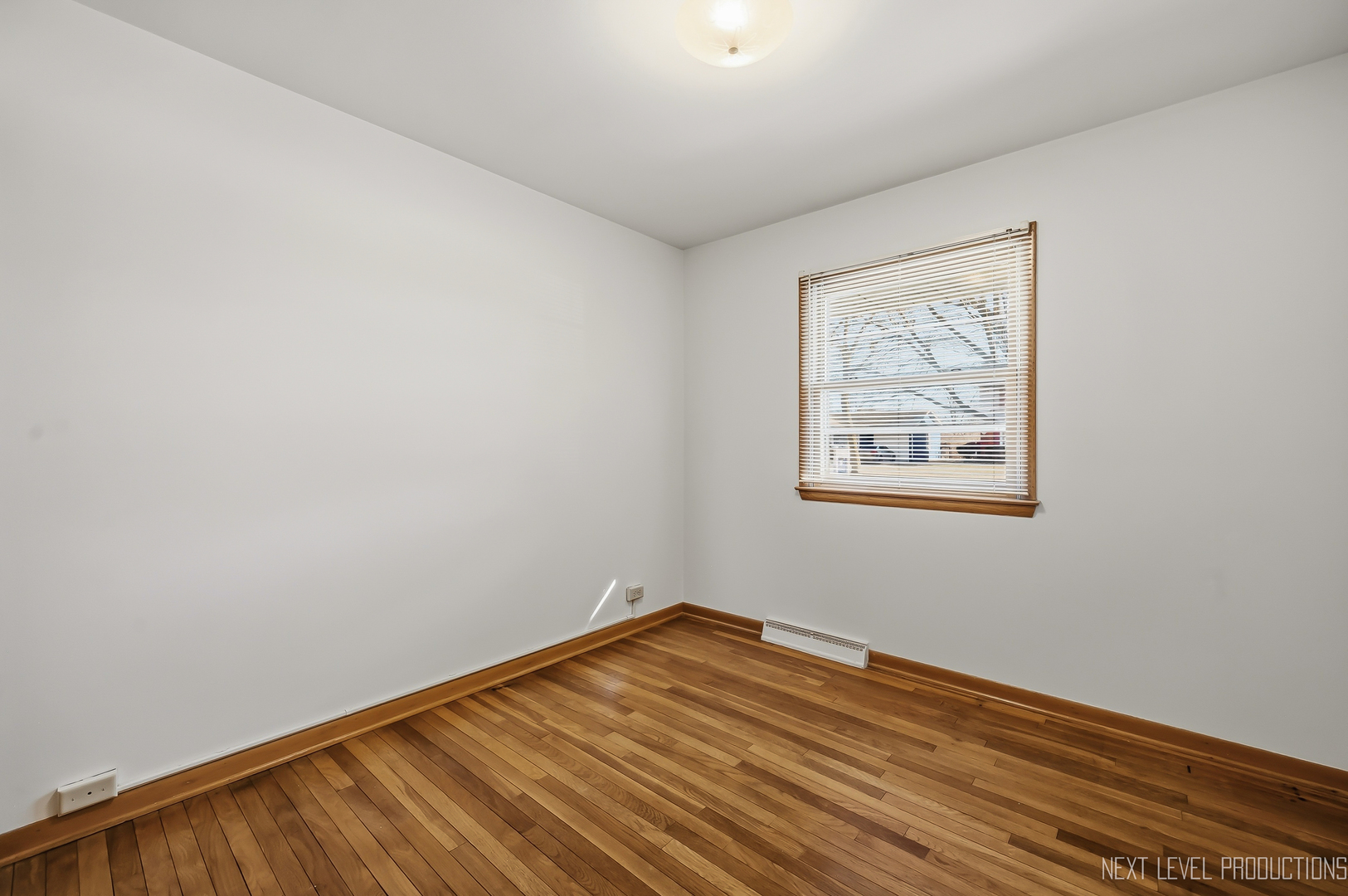 906 Carol Avenue Elgin, IL 60123 - Photo 15 of 31 a view of empty room with wooden floor