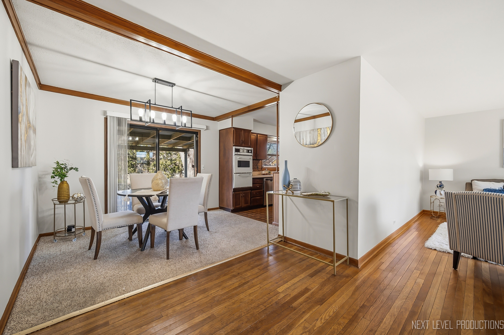 906 Carol Avenue Elgin, IL 60123 - Photo 4 of 31 a view of a dining room with furniture window and wooden floor