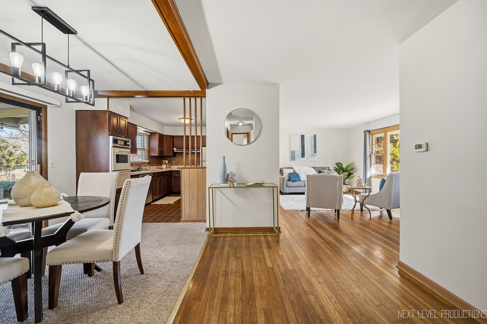 906 Carol Avenue Elgin, IL 60123 - Photo 6 of 31 a view of a dining room with furniture window and wooden floor