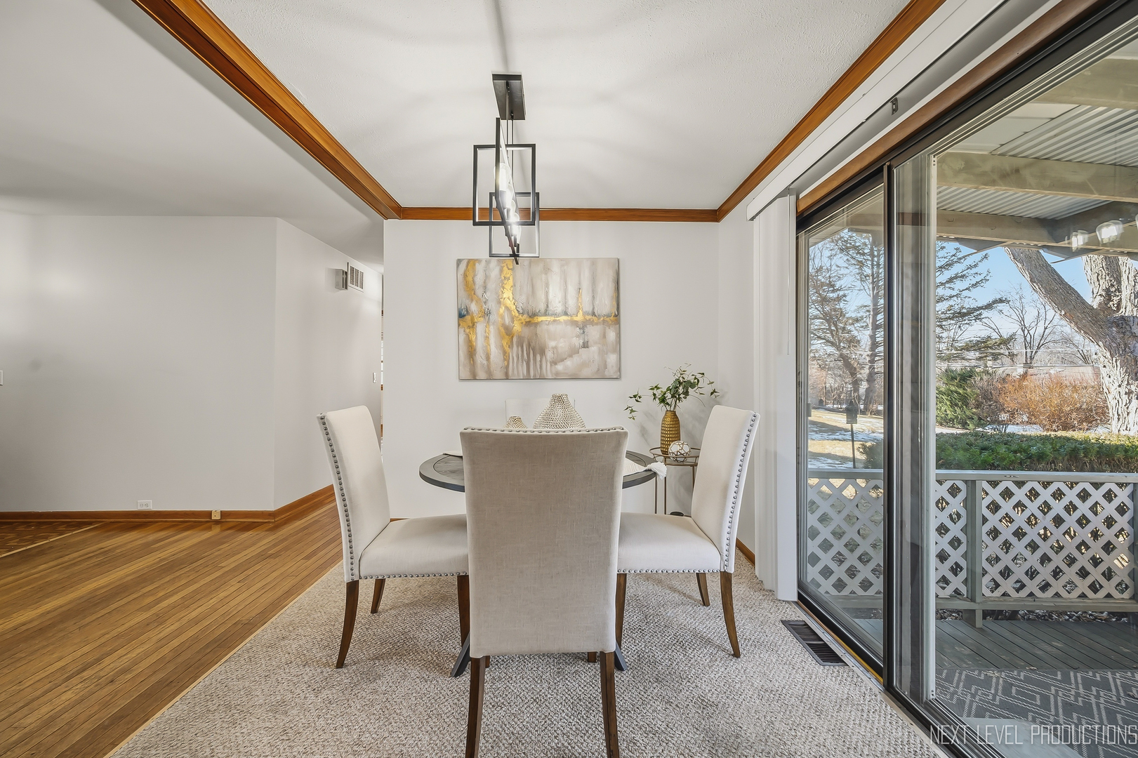 906 Carol Avenue Elgin, IL 60123 - Photo 9 of 31 a view of a dining room with furniture window and wooden floor