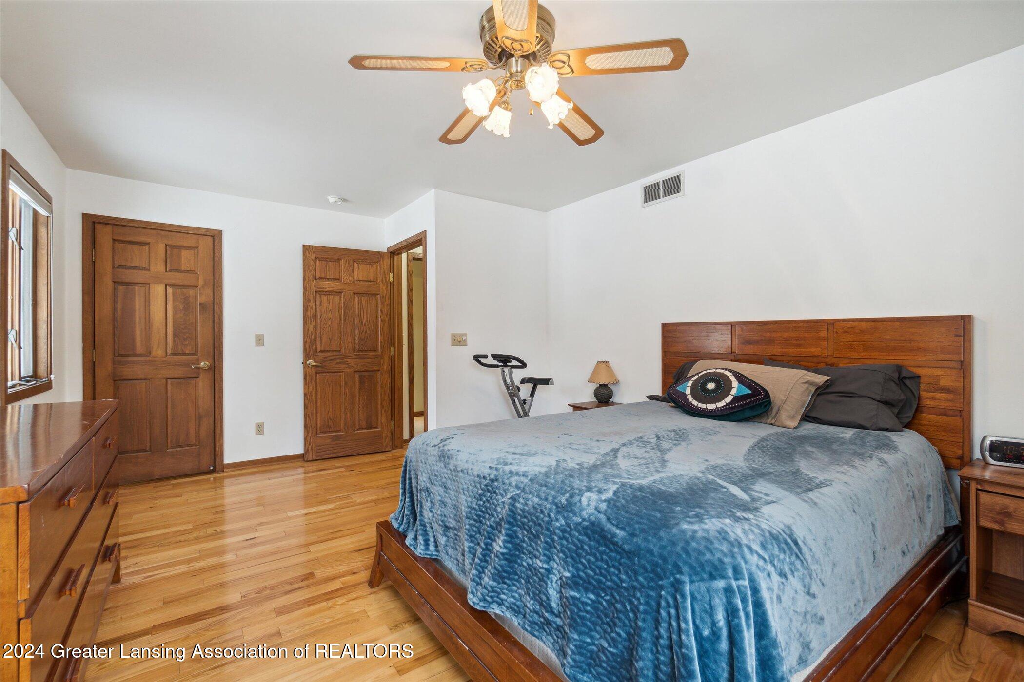 14725 Nichols Road Bath, MI 48808 - Photo 19 of 53 Ceiling fan/wood floors