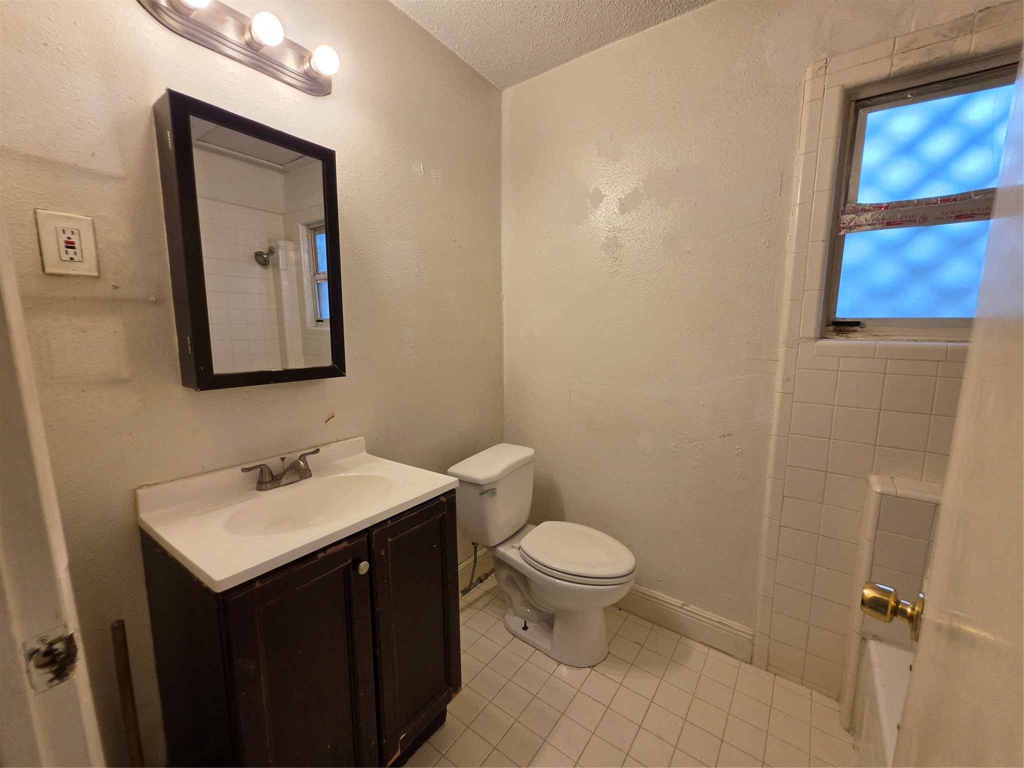 1226 West Gray Street, Unit 2 Houston, TX 77019 - Photo 12 of 14 a bathroom with a toilet sink and mirror