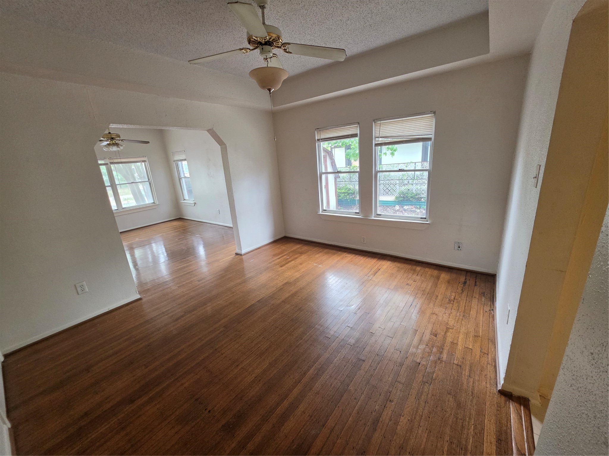 1226 West Gray Street, Unit 2 Houston, TX 77019 - Photo 4 of 14 a view of empty room with wooden floor and fan