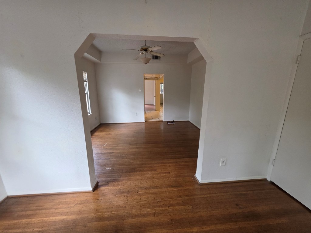 1226 West Gray Street, Unit 2 Houston, TX 77019 - Photo 8 of 14 a view of a livingroom with wooden floor and a ceiling fan
