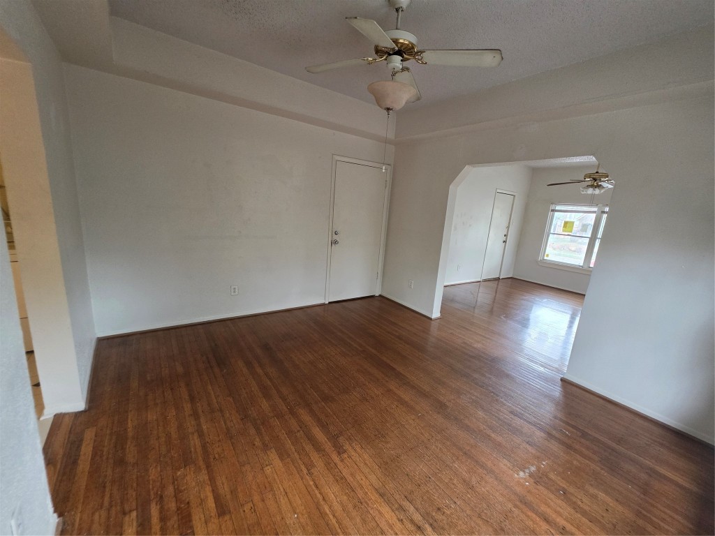 1226 West Gray Street, Unit 2 Houston, TX 77019 - Photo 9 of 14 wooden floor in an empty room with a window
