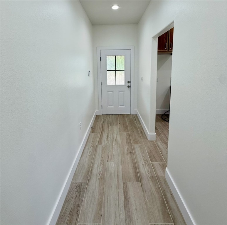 3939 Harvey Robstown, TX 78380 - Photo 12 of 17 wooden floor in a empty room with a window