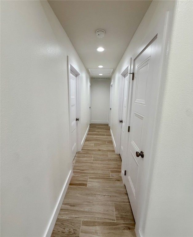 3939 Harvey Robstown, TX 78380 - Photo 13 of 17 a view of a hallway with wooden floor and white doors