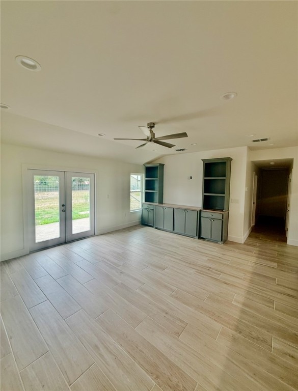 3939 Harvey Robstown, TX 78380 - Photo 14 of 17 a view of empty room with wooden floor and windows