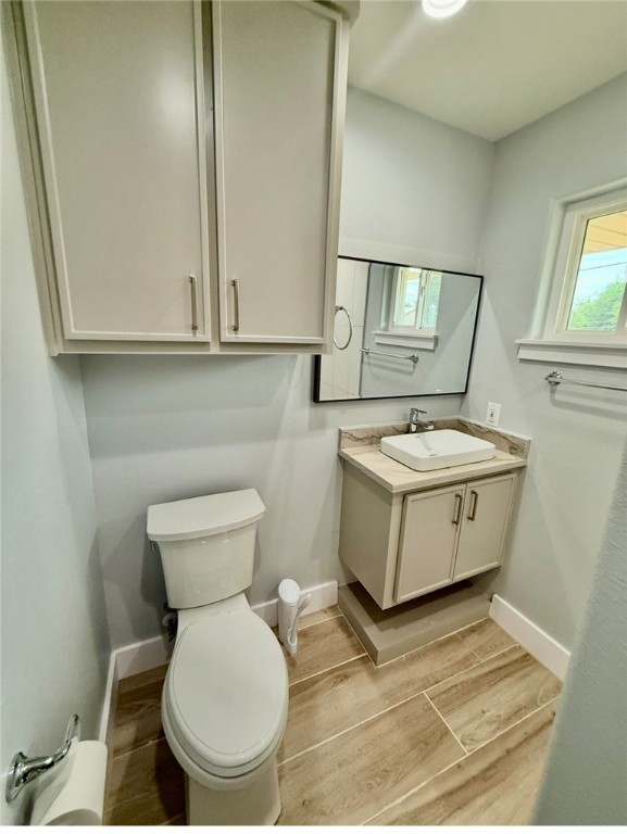 3939 Harvey Robstown, TX 78380 - Photo 17 of 17 a bathroom with a sink a toilet and mirror