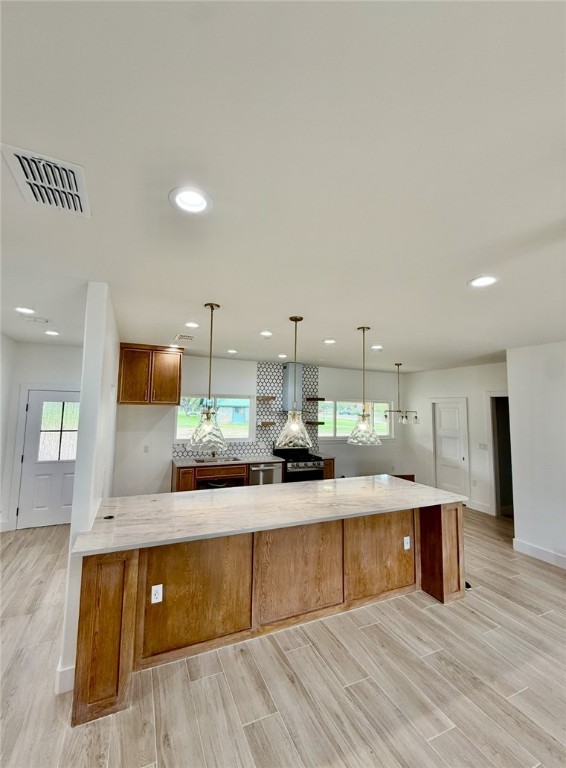 3939 Harvey Robstown, TX 78380 - Photo 4 of 17 a large kitchen with stainless steel appliances granite countertop a large counter top and a wooden floors