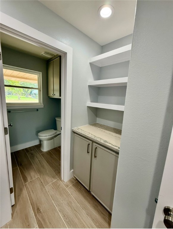 3939 Harvey Robstown, TX 78380 - Photo 7 of 17 a bathroom with a toilet sink and mirror