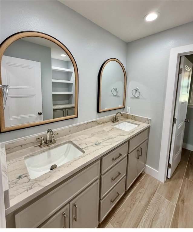 3939 Harvey Robstown, TX 78380 - Photo 8 of 17 a bathroom with a double vanity sink and a mirror