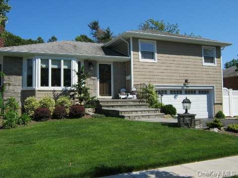 10 Radnor Road Plainview, NY 11803 - Photo 1 of 1 a view of a house with a yard