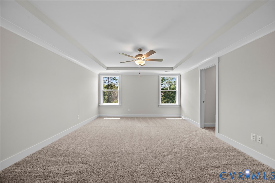 3917 Jett Court Gum Spring, VA 23065 - Photo 6 of 12 a view of a big room with windows and chandelier fan
