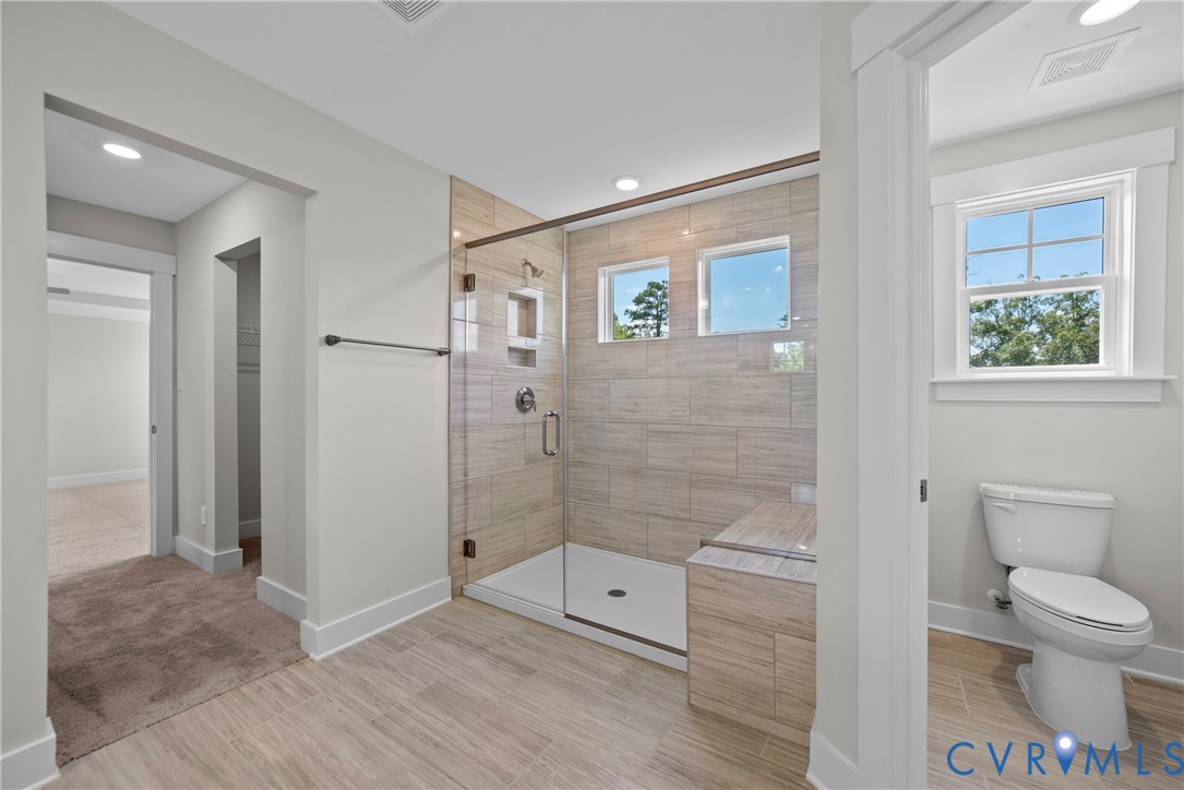 3917 Jett Court Gum Spring, VA 23065 - Photo 7 of 12 a bathroom with a toilet and a shower