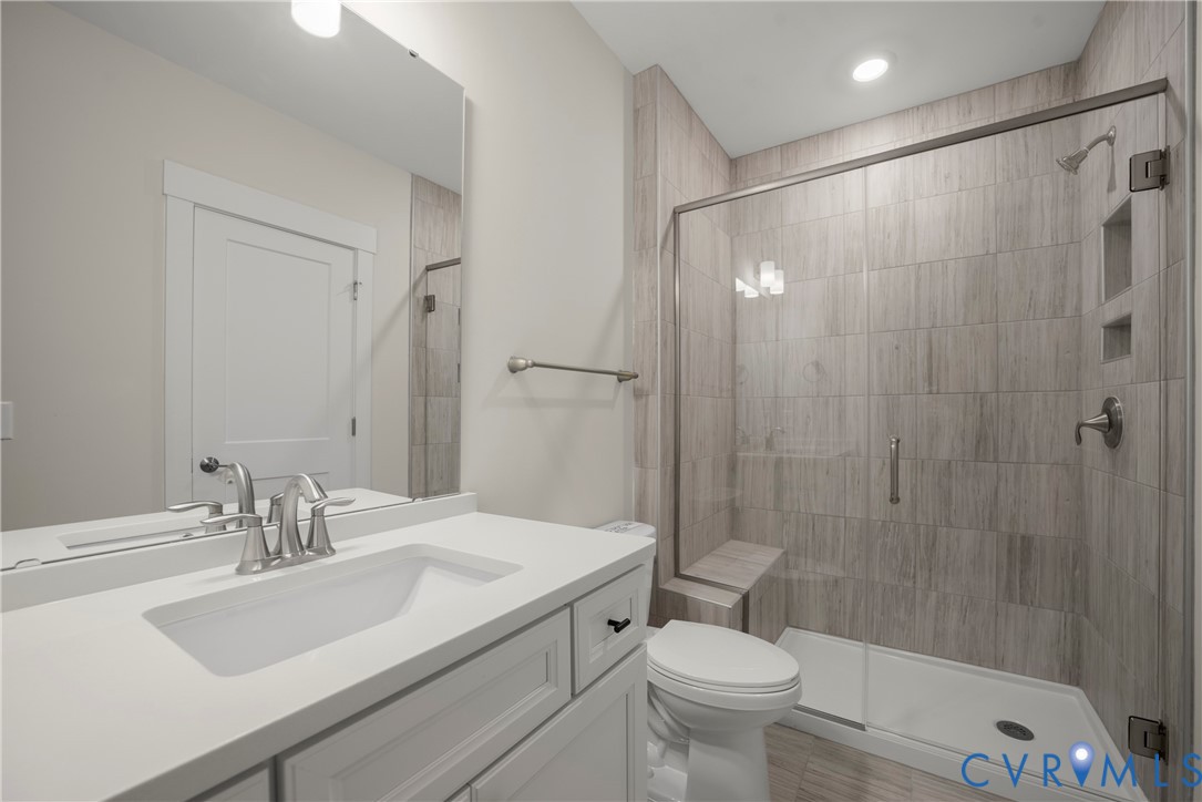 3917 Jett Court Gum Spring, VA 23065 - Photo 9 of 12 a bathroom with a sink toilet and shower