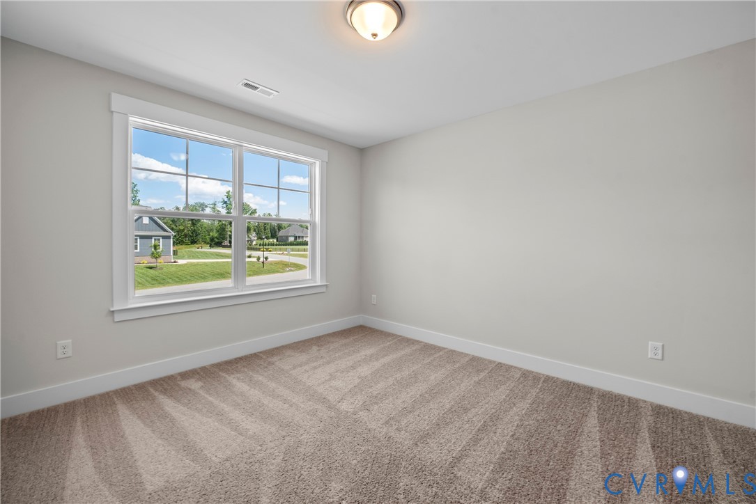 3917 Jett Court Gum Spring, VA 23065 - Photo 10 of 12 wooden floor in an empty room with a window
