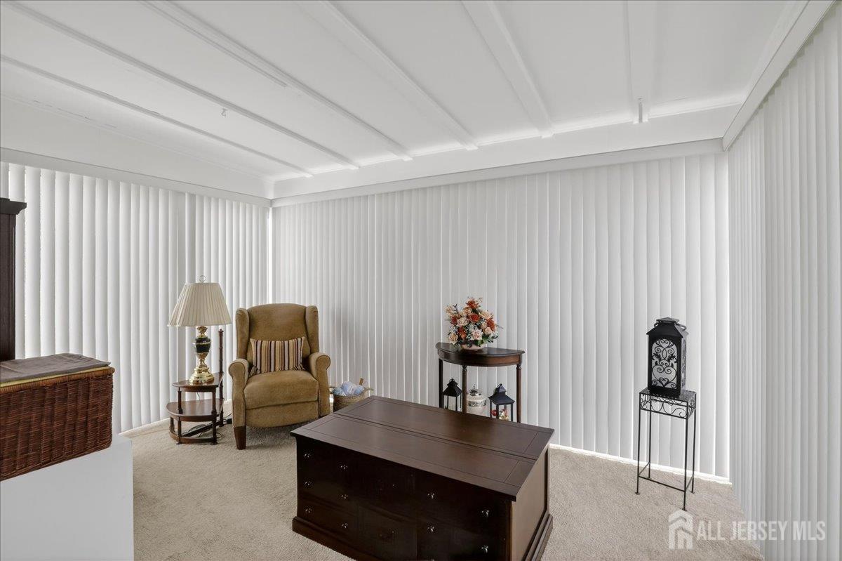 205A Newport Road, Unit A Monroe Township, NJ 08831 - Photo 12 of 26 a living room with furniture and a flat screen tv