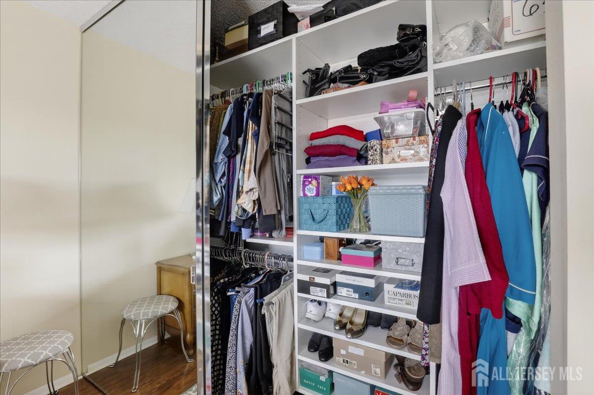 205A Newport Road, Unit A Monroe Township, NJ 08831 - Photo 15 of 26 a view of walk in closet with clothes and shoes