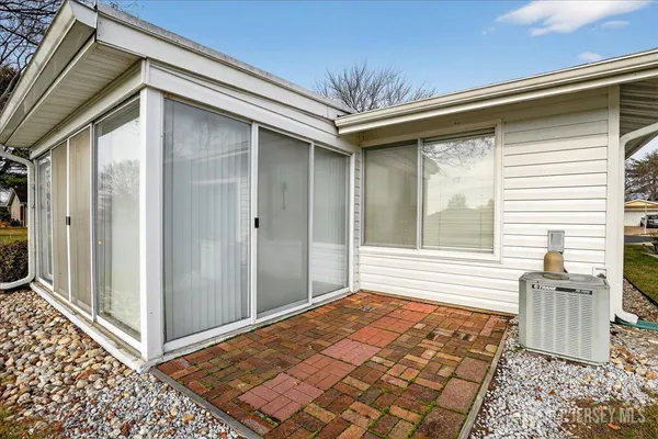 a view of a porch with a door and outside space