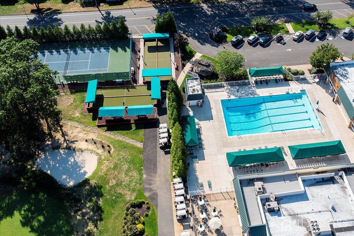 205A Newport Road, Unit A Monroe Township, NJ 08831 - Photo 19 of 26 an aerial view of a house with a yard basket ball court and outdoor seating