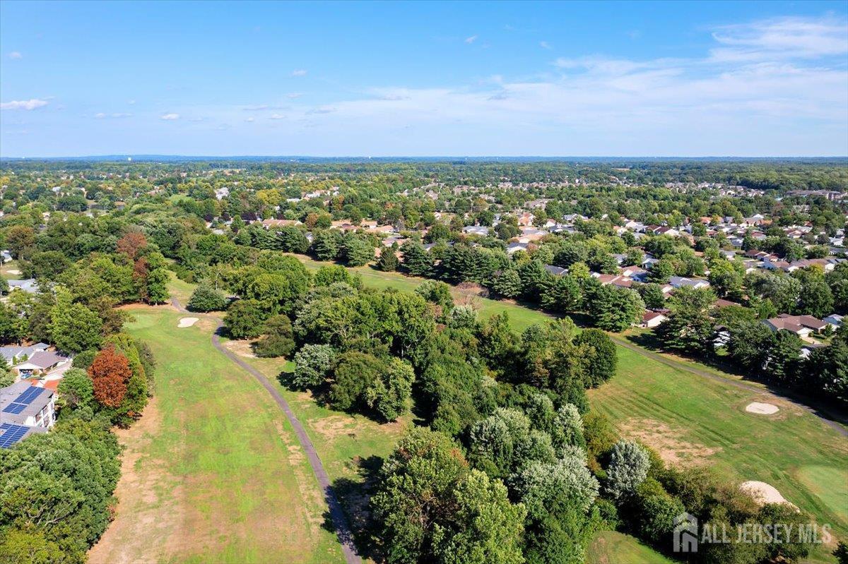 205A Newport Road, Unit A Monroe Township, NJ 08831 - Photo 22 of 26 an aerial view of residential houses with outdoor space and trees