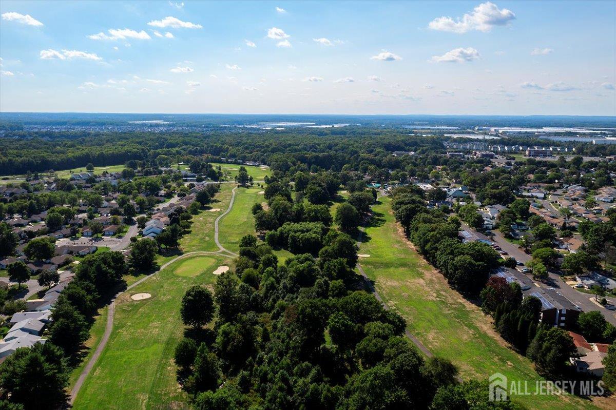 205A Newport Road, Unit A Monroe Township, NJ 08831 - Photo 23 of 26 an aerial view of residential houses with outdoor space and trees