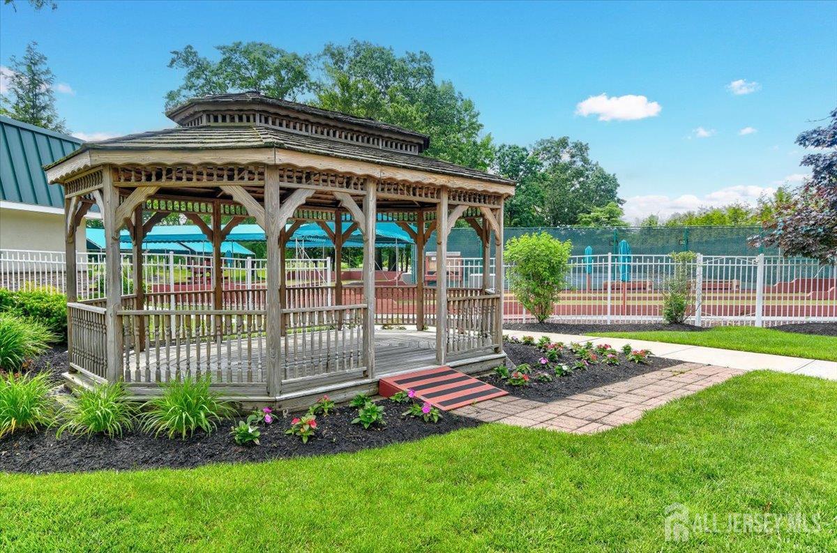 205A Newport Road, Unit A Monroe Township, NJ 08831 - Photo 25 of 26 a view of a chair and table in the garden