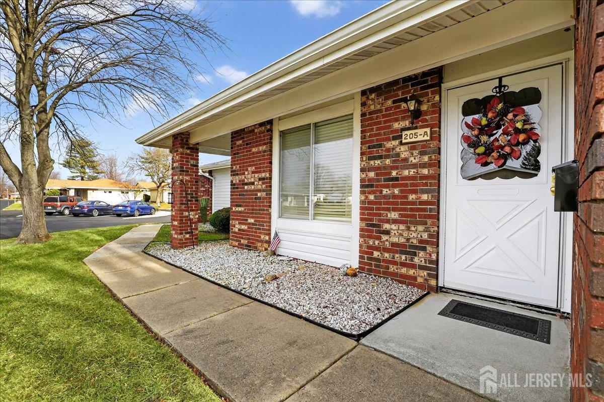 205A Newport Road, Unit A Monroe Township, NJ 08831 - Photo 4 of 26 a front view of a house with garden