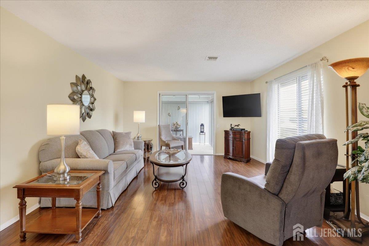 205A Newport Road, Unit A Monroe Township, NJ 08831 - Photo 7 of 26 a living room with furniture and a flat screen tv