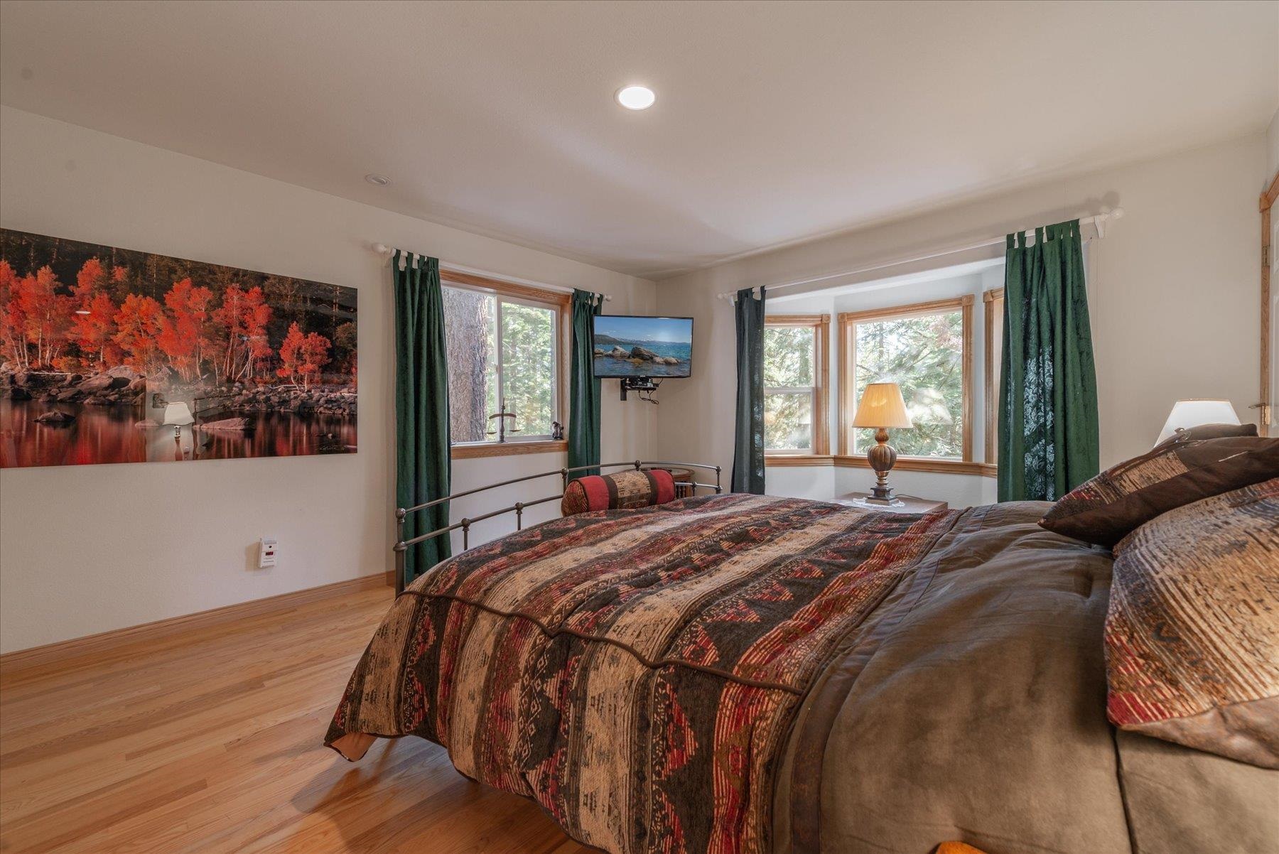 955 The Drive Tahoe City, CA 96145 - Photo 11 of 21 a bedroom with a large bed and a window