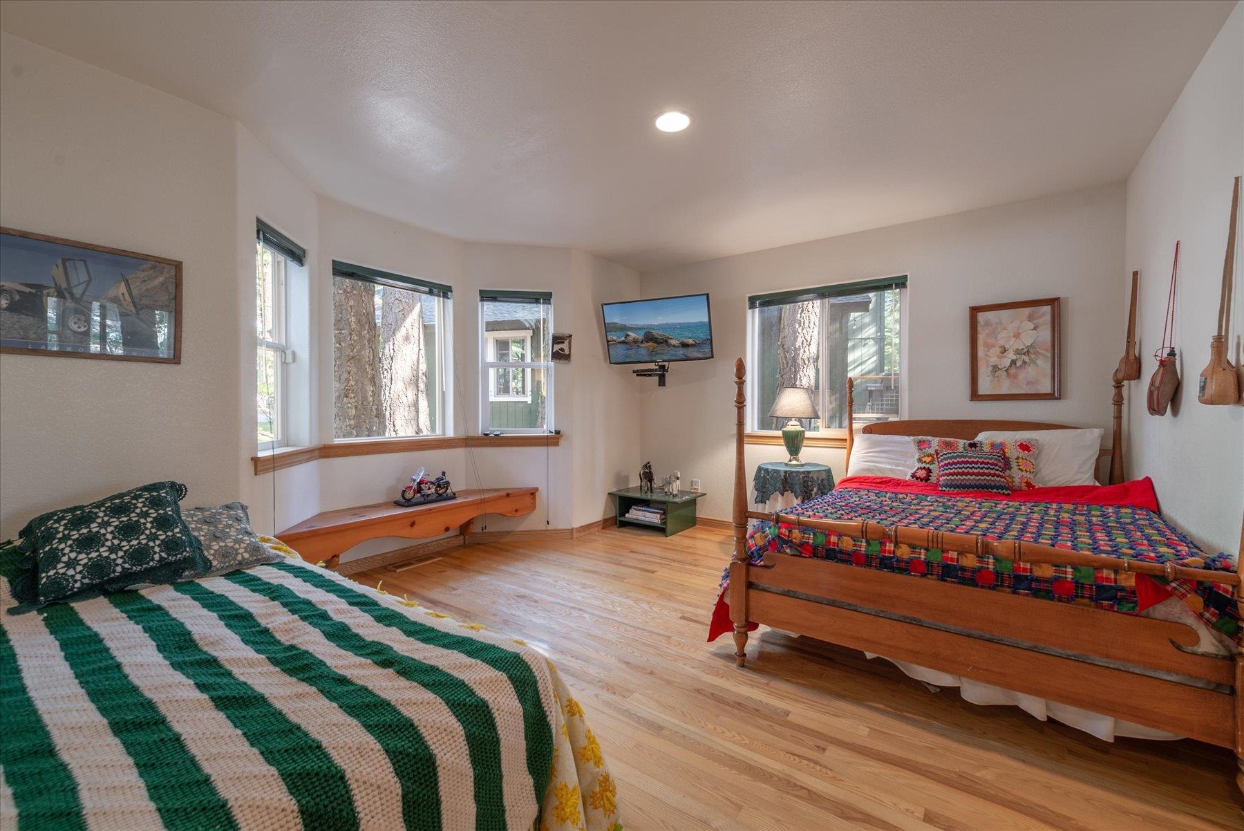 955 The Drive Tahoe City, CA 96145 - Photo 14 of 21 a bedroom with a bed and wooden floor