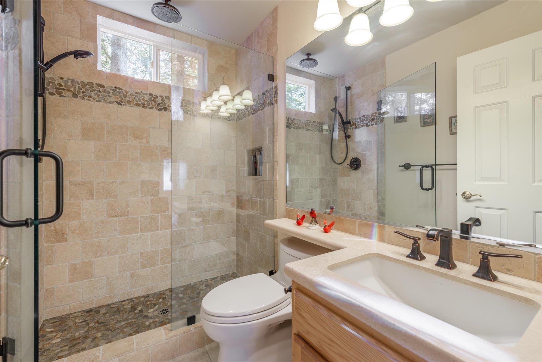 955 The Drive Tahoe City, CA 96145 - Photo 17 of 21 a bathroom with a sink toilet and shower