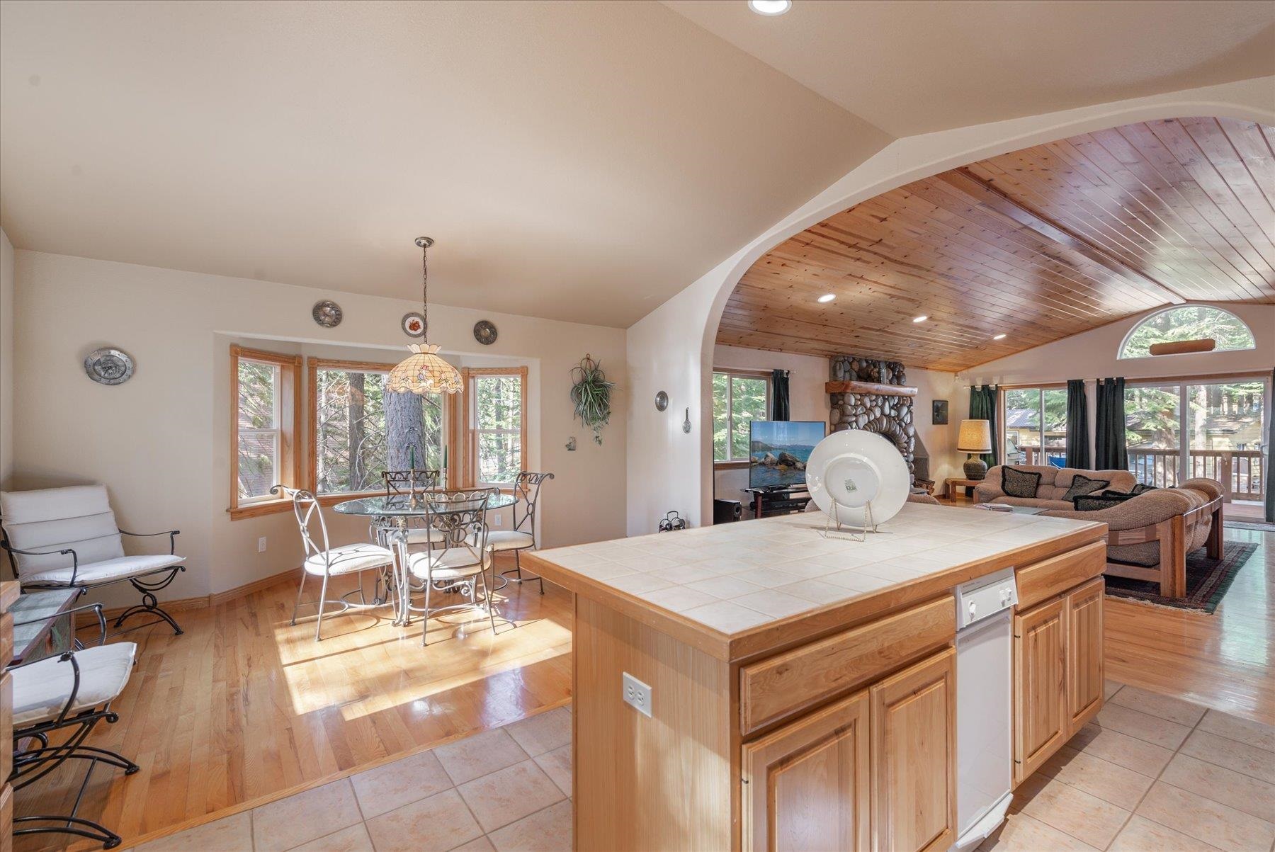955 The Drive Tahoe City, CA 96145 - Photo 7 of 21 a large kitchen with a table and chairs in it