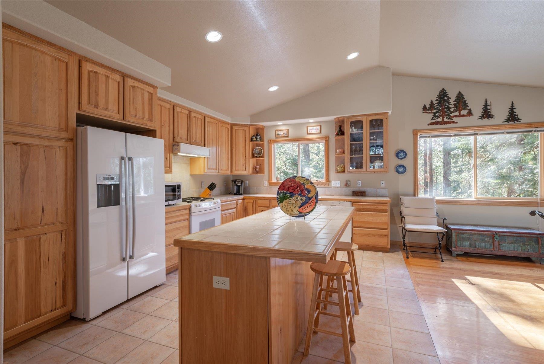 955 The Drive Tahoe City, CA 96145 - Photo 8 of 21 a kitchen with stainless steel appliances granite countertop a refrigerator sink and cabinets