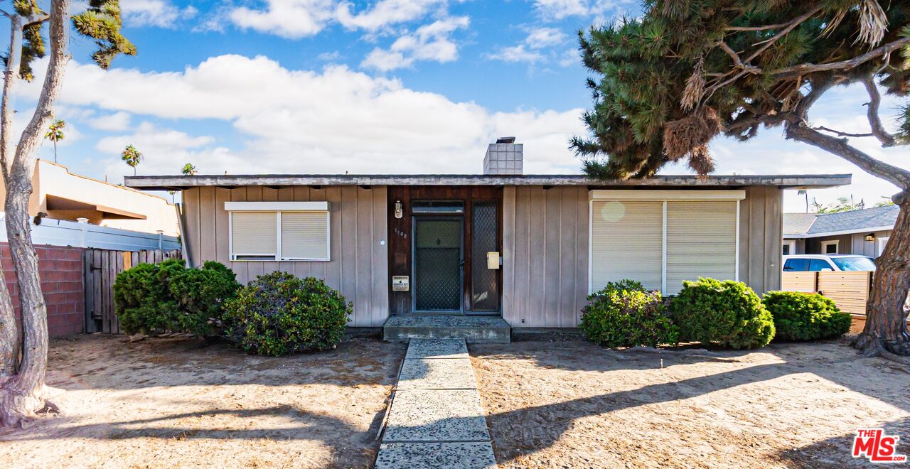 1408 251st Street Harbor City, CA 90710 - Photo 1 of 40 a front view of a house with garden