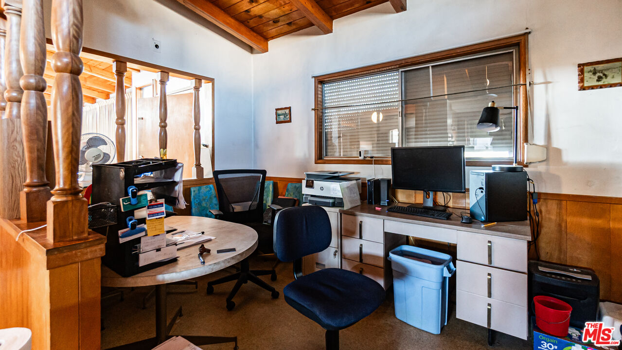 1408 251st Street Harbor City, CA 90710 - Photo 12 of 40 a view of a workspace with furniture and a window