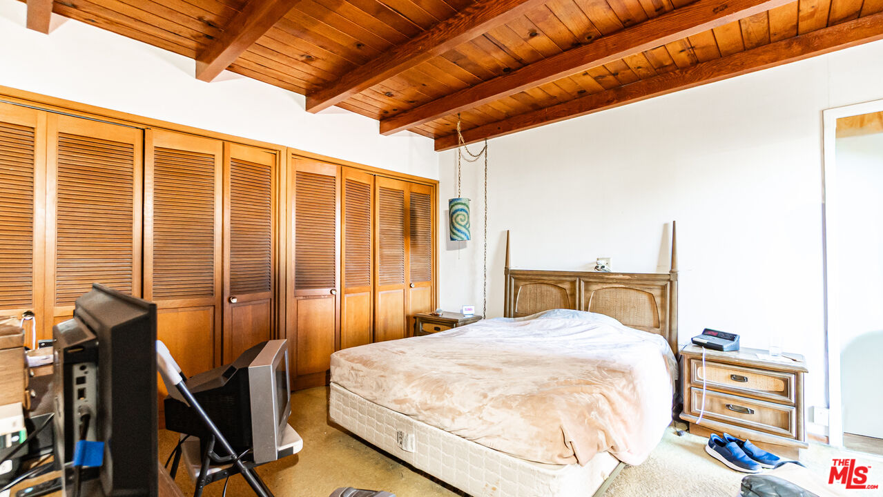 1408 251st Street Harbor City, CA 90710 - Photo 21 of 40 a bedroom with a bed a table and chairs