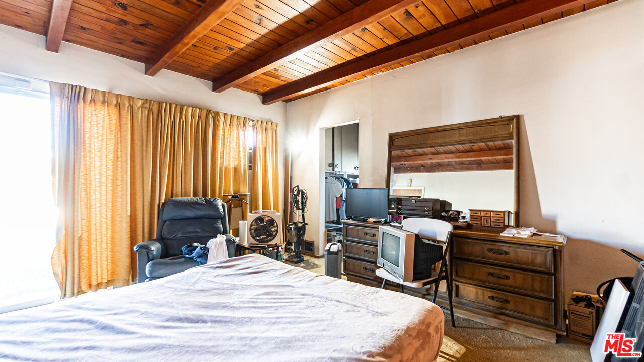 1408 251st Street Harbor City, CA 90710 - Photo 22 of 40 a bed room with a bed and a chair