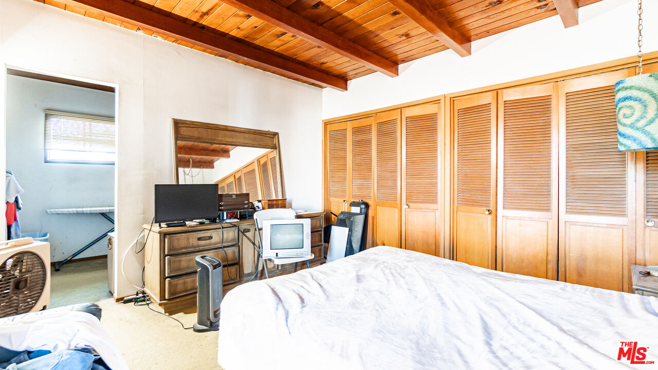 1408 251st Street Harbor City, CA 90710 - Photo 26 of 40 a bedroom with a bed a desk and chair with outer view