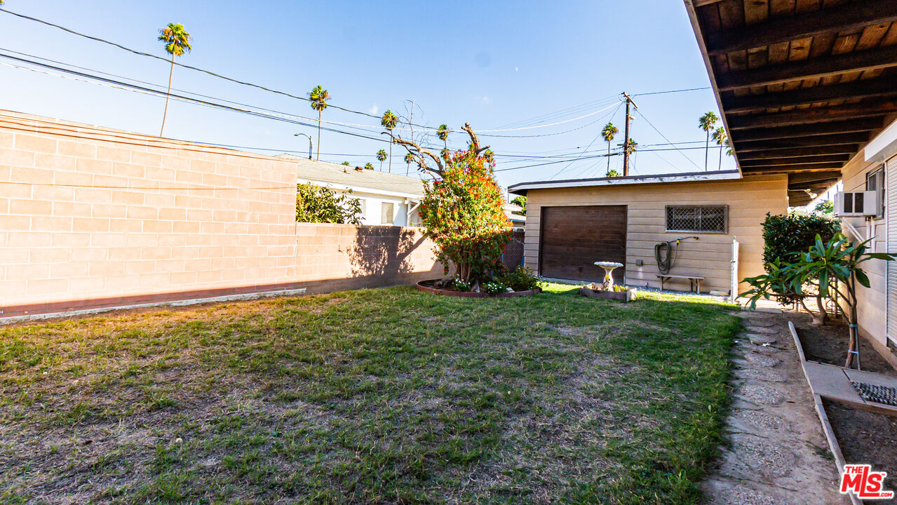1408 251st Street Harbor City, CA 90710 - Photo 30 of 40 a view of a house with backyard and a garden