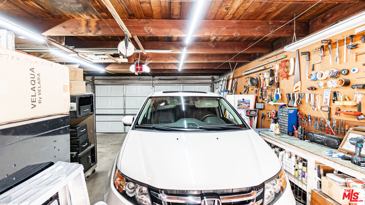 1408 251st Street Harbor City, CA 90710 - Photo 36 of 40 a view of a kitchen with a sink and wooden cabinets