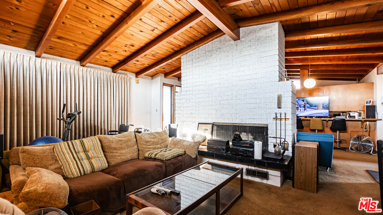 1408 251st Street Harbor City, CA 90710 - Photo 6 of 40 a living room with furniture a fireplace and next to a window