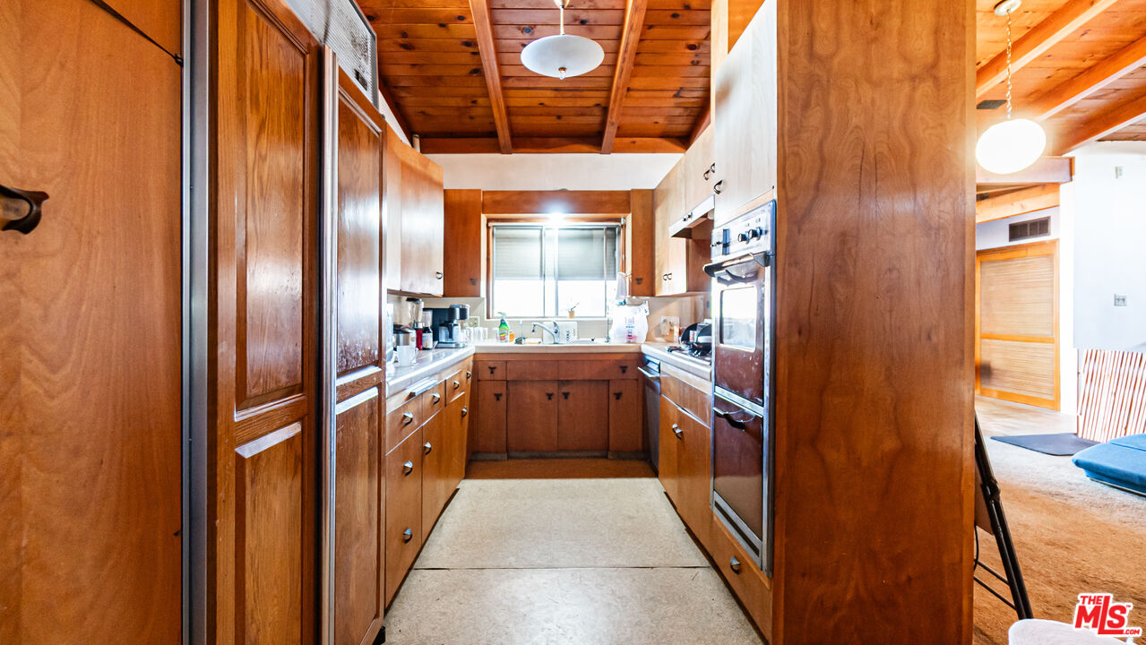 1408 251st Street Harbor City, CA 90710 - Photo 8 of 40 a kitchen with stainless steel appliances granite countertop a refrigerator and dishwasher