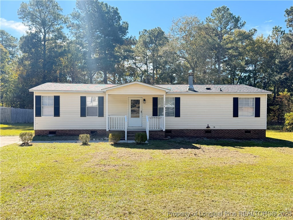 a view of a house with swimming pool and a yard