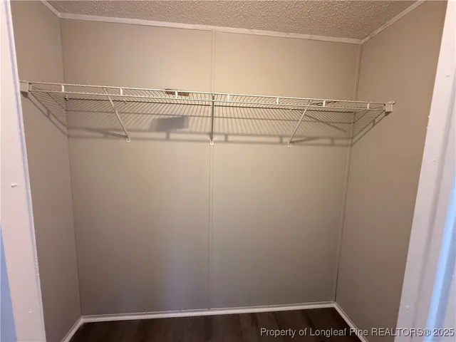 a view of a room with racks on the wall