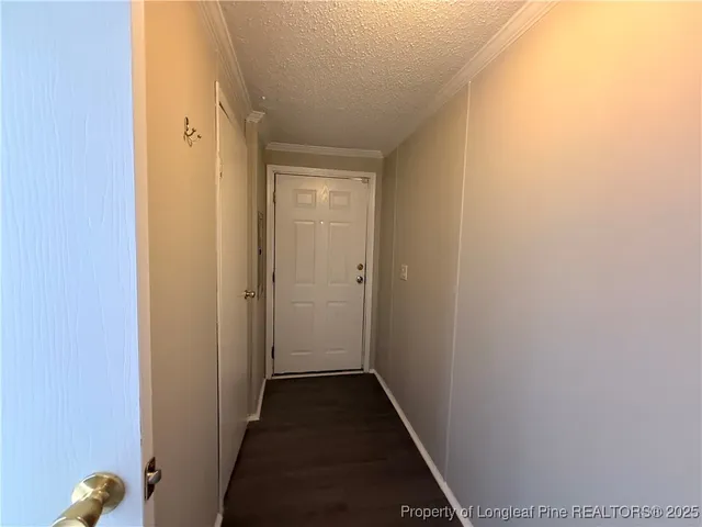 a view of a livingroom from a hallway