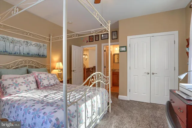 a bedroom with a bed and a walk in closet