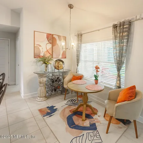 a view of a dining room with furniture window and outside view
