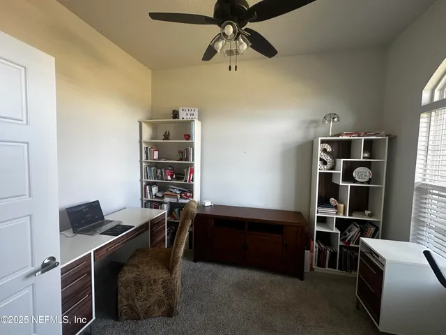 a workspace with furniture and window